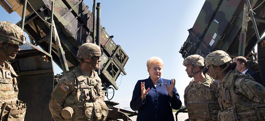 Would Lithuania's president be so pumped if she knew the Patriot's record?