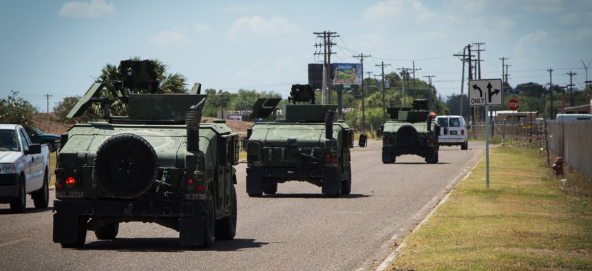 A convoy of Texas National Guard vehicles departs to the Texas-Mexico border in 2014 as part of Obama's Operation Strong Safety . 