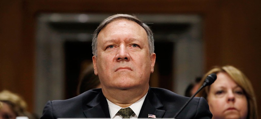  Mike Pompeo listens during his confirmation hearing with the Senate Foreign Relations Committee on April 12.