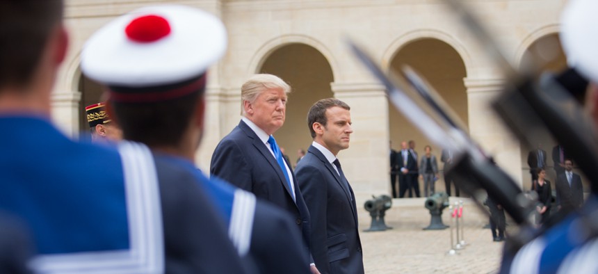 President Donald J. Trump and President Emmanuel Macron walk in Paris in 2017.
