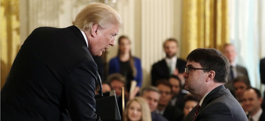 President Trump shakes hands with Acting Veterans Affairs Secretary Robert Wilkie, during an event on prison reform in the East Room of the White House, Friday, May 18.