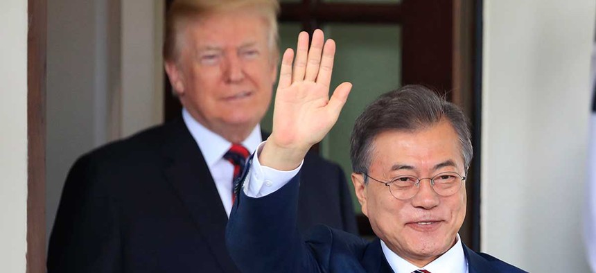 South Korean President Moon Jae-in waves as he is welcomed by President Donald Trump to the White House on Tuesday.