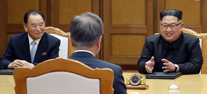 Kim Yong Chol, left, and Kim Jong-un meet with South Korean President Moon Jae-in on May 27.