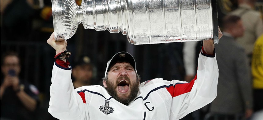 Washington Capitals left wing Alex Ovechkin, of Russia, hoists the Stanley Cup after the Capitals defeated the Golden Knights in Game 5 of the NHL hockey Stanley Cup Finals on June 7.