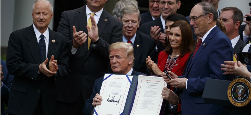 President Trump holds a signing ceremony earlier this month for a bill to overhaul VA health care. During that ceremony he spoke about the difficulty of firing bad employees. 