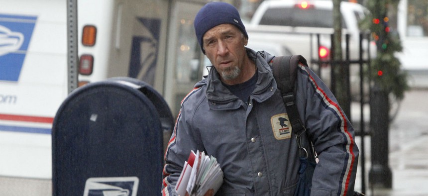 Postal worker Mike Gillis delivers mail in Vermont. 