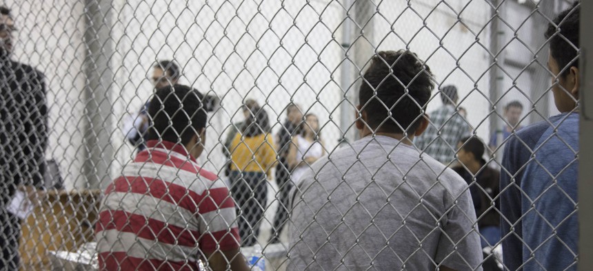 U.S. Border Patrol agents conduct intake of illegal border crossers at the Central Processing Center in McAllen, Texas.