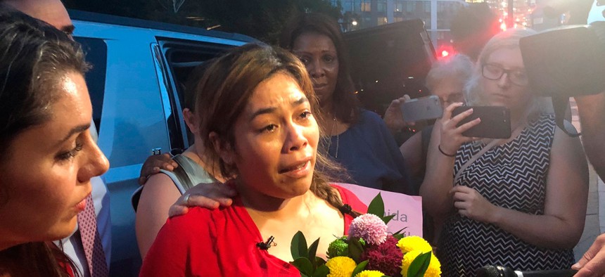 An immigrant mother separated from her children speaks to reporters in New York on July 2.