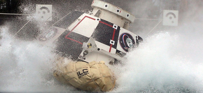 A mock-up of Boeing's CST-100 Starliner splashes down in 2016