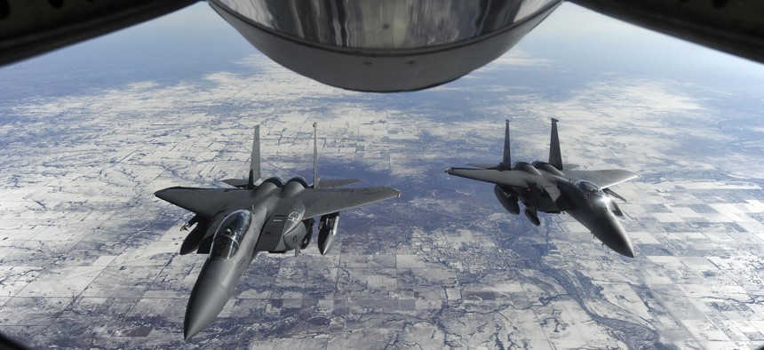 The proposed F-15X will have a one-person cockpit, not the pilot-and-weaponeer team in these F-15E Strike Eagles.