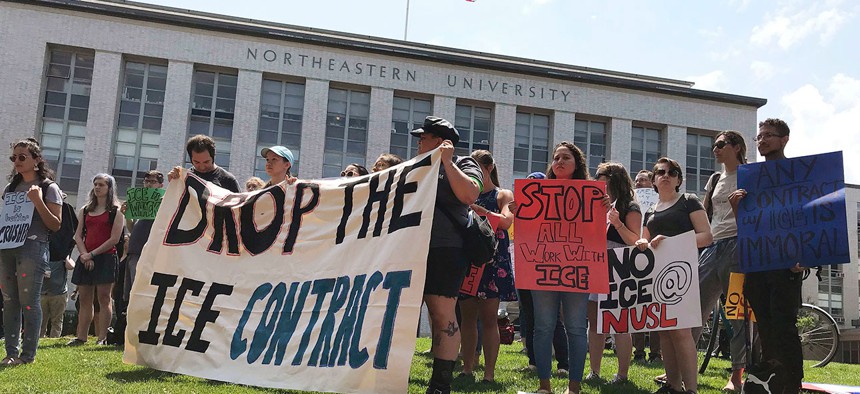 Students and community activists at Northeastern University called on the school to nix an ICE contract in July.