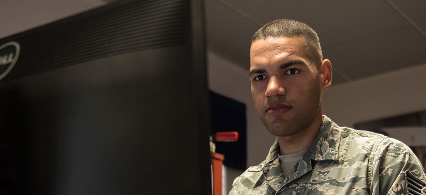 Air Force Staff Sgt. Bryant Lopez-Cepero, 728th Air Mobility Squadron unit training manager, works at his computer at Incirlik Air Base in Turkey in July.