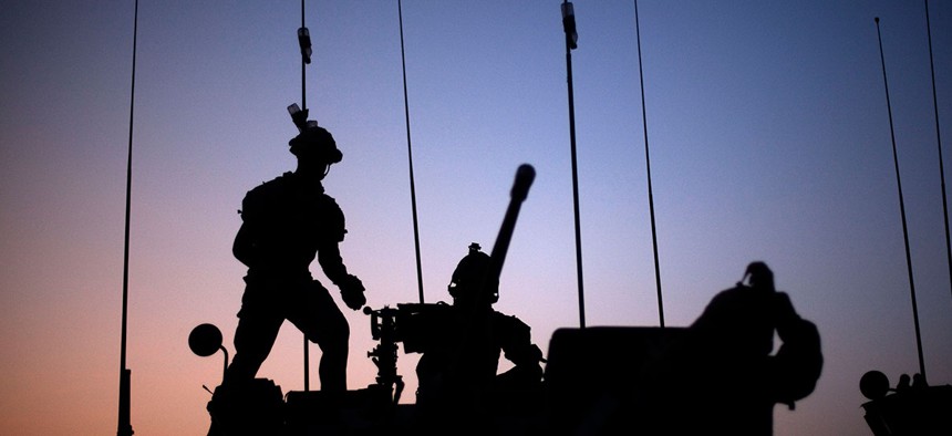 Soldiers with the Canadian Army's 1st Battalion 22nd Royal Regiment prepare for an operation at sunrise Monday, June 27, 2011 on Forward Operating Base Sperwan Ghar in the Panjwaii district of Kandahar province, Afghanistan