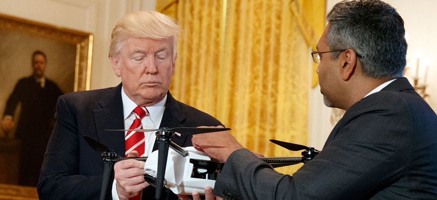 Trump examines a drone in 2017.