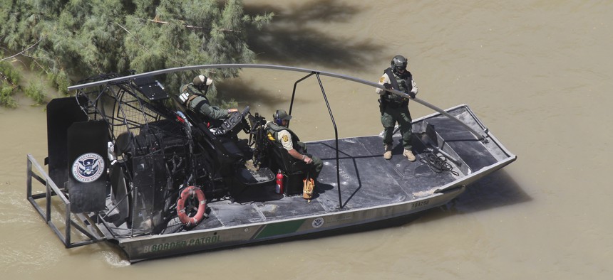 A Border Patrol Riverine Unit conducts patrols in an Air and Marine Air-Boat in South Texas, Laredo, along the Rio Grande Valley river in 2013.