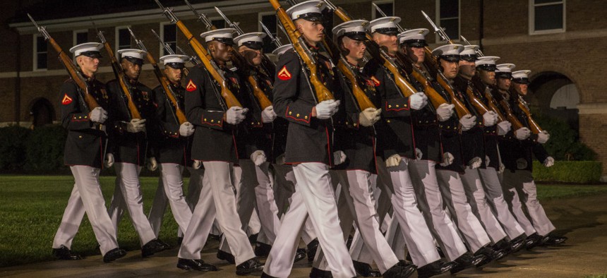 Marines with Alpha Company, Marine Barracks Washington D.C., march during a Friday evening parade in early August. 