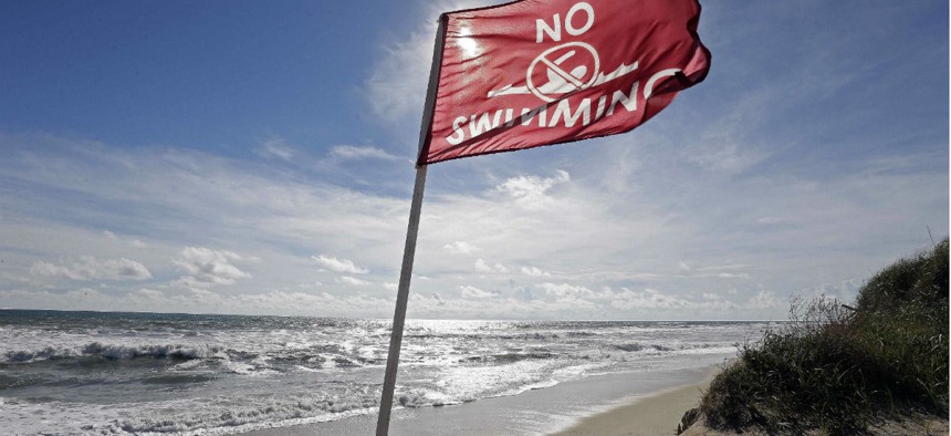 A flag warns against swimming in Nags Head, N.C., as Hurricane Florence approaches. 