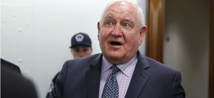 Agriculture Secretary Sonny Perdue speaks with reporters in April after testifying on USDA's fiscal 2019 budget. 