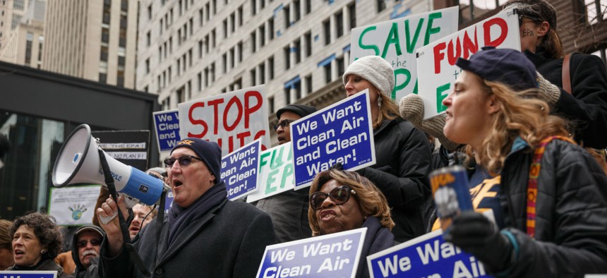 EPA employees protest job cuts at the agency in March 2017. The Trump administration has tried to curtail the role of federal unions.