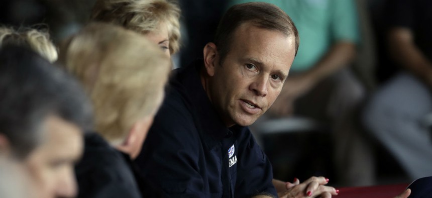 FEMA Administrator Brock Long (right) attends a briefing after visiting areas impacted by Hurricane Florence last week. 