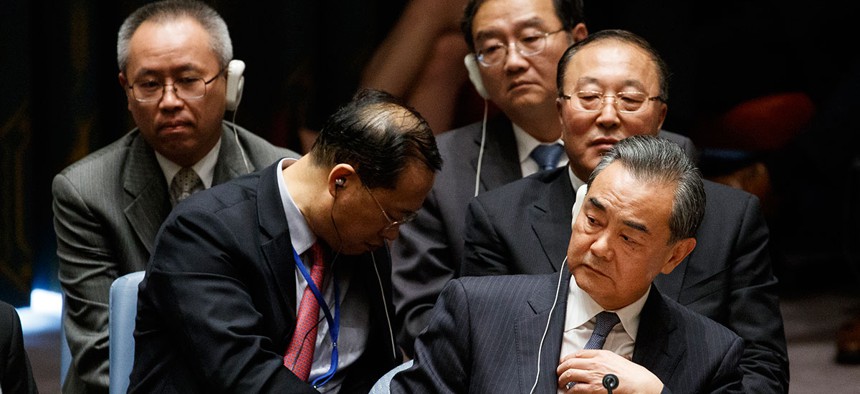 Chinese Foreign Minister Wang Yi listens during a UN Security Council session chaired by Donald Trump.