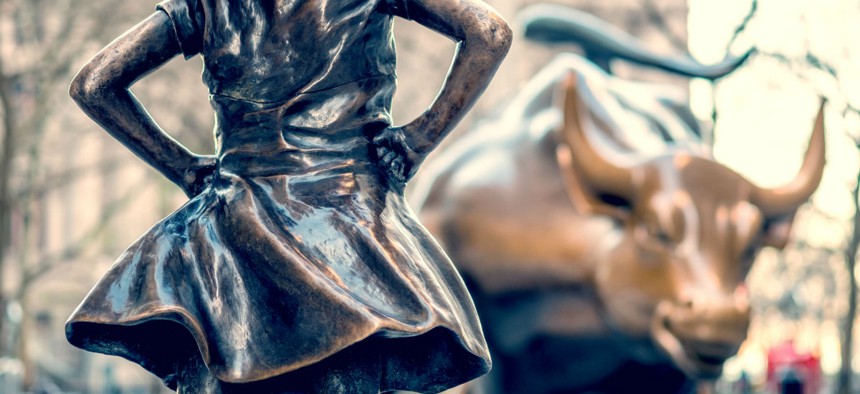 "The Fearless Girl" statue facing Charging Bull in Lower Manhattan, New York City.