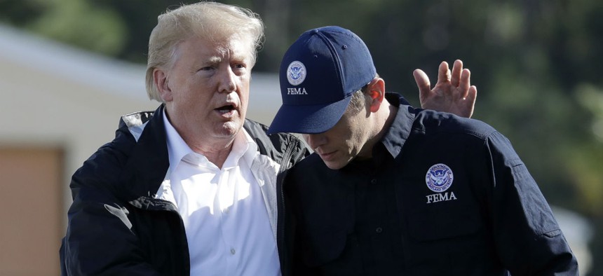 FEMA Administrator Brock Long (right) speaks with President Trump after visiting areas in North Carolina and South Carolina affected by Hurricane Florence. 