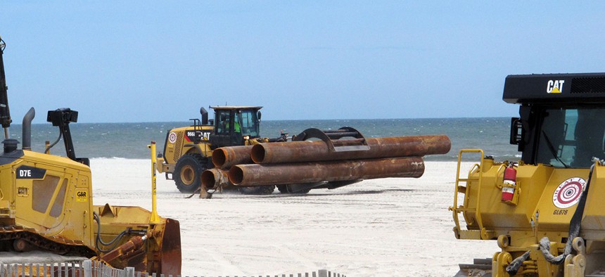 Heavy equipment carries out a beach replenishment project at the south end of Ocean City, N.J., in 2016.