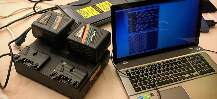 A scene from the Voter Hacking room at DEFCON 2018, where hackers were able to compromise voting machine data in less than 20 minutes.