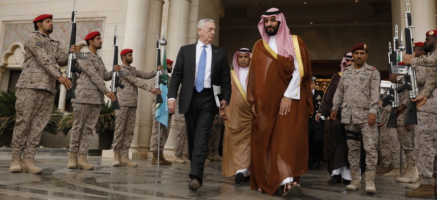 In this April 19, 2017 photo, U.S. Defense Secretary James Mattis, center left, departs after his meeting with Saudi Arabia's Deputy Crown Prince and Defense Minister Mohammed bin Salman, center right, in Riyadh, Saudi Arabia.