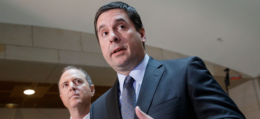 House Intelligence Committee Chairman Rep. Devin Nunes, R-Calif., right, accompanied by the committee's ranking member, Rep. Adam Schiff, D-Calif., talks to reporters, on Capitol Hill in 2017.