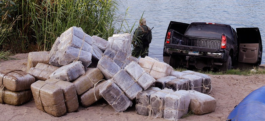 U.S. Customs and Border Patrol and Texas Department of Public Safety seize 57 bundles of marijuana weighing more than 1,200 pound at the Texas border along the Rio Grande in Abram, Texas in 2011.