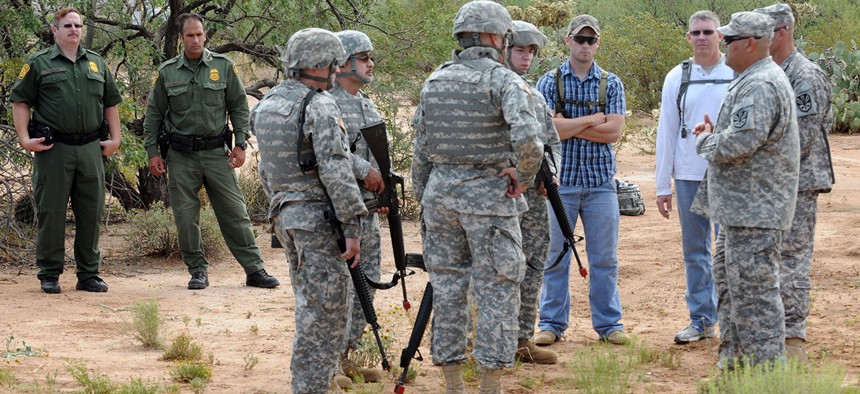 Border Patrol agents observe Arizona National Guard Soldiers training in Arizona in 2010.
