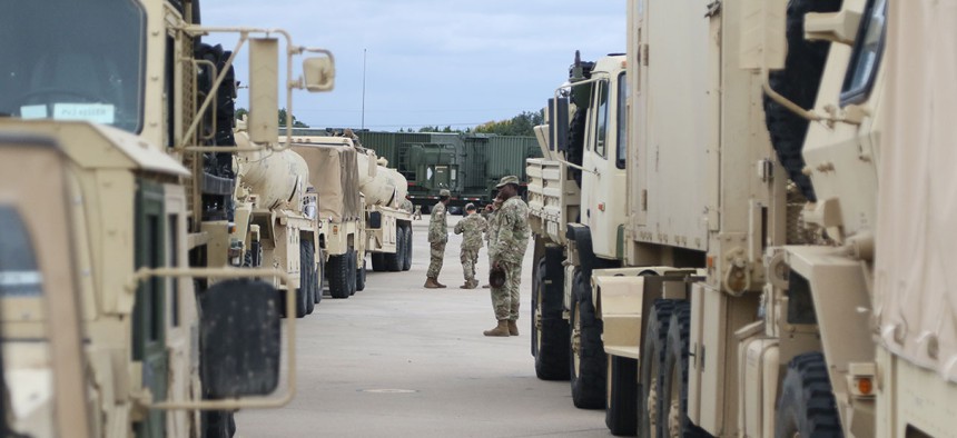 Soldiers prepare their vehicles on Oct. 31 to roll out from Fort Hood to the border.