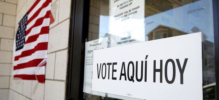 A sign announces a polling place in Spanish outside of the Harrison Community Center during New Jersey's primary election in June in Harrison, N.J.