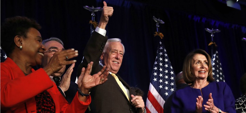House Minority Leader Nancy Pelosi of Calif., right, celebrates midterm election returns as House Minority Whip Steny Hoyer, D-Md., makes the thumbs up sign. Also pictured: Rep. Barbara Lee, D-Calif., and Rep. G.K. Butterfield, D-N.C., chair of the Congre