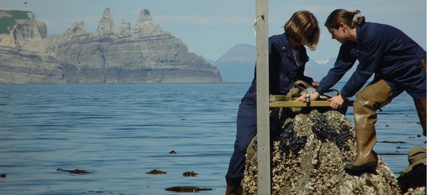 NOAA employees install a tide gauge near Castle Cape, Alaska. 