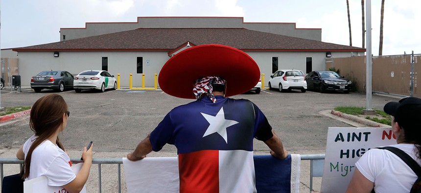 Demonstrators stand outside the U.S. Border Patrol Central Processing Center during a protest in June in Texas.
