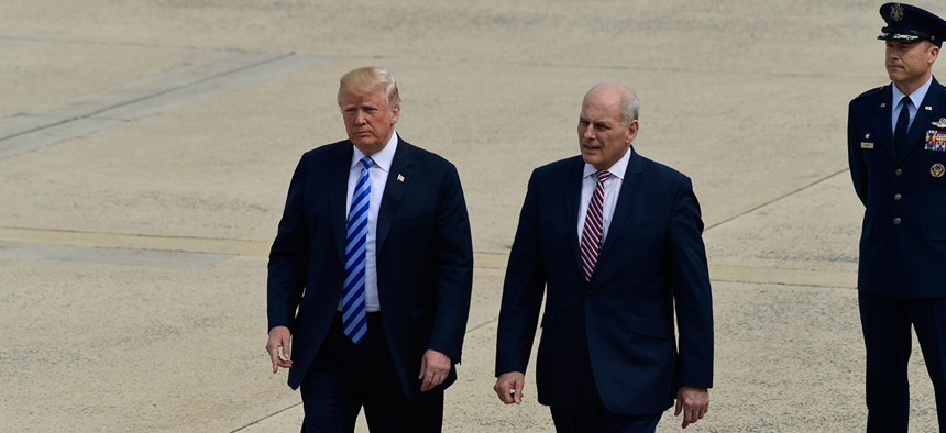 President Donald Trump and White House Chief of Staff John Kelly walk on the tarmac at Andrews Air Force Base in May.