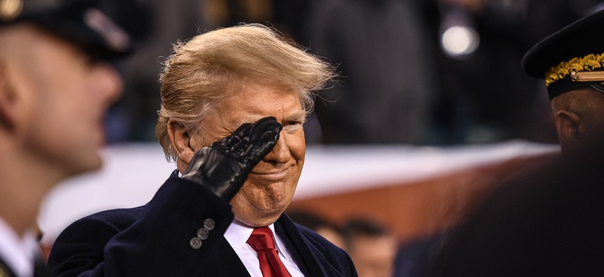 President Donald Trump renders a salute during the 119th Army-Navy Game in Philadelphia on Dec. 8.