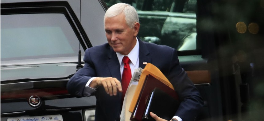 Vice President Mike Pence arrives at the White House on Dec. 21, the day funding for some agencies ran out. Pence is one of the appointees who would be due for a pay raise if Congress doesn't extend the freeze. 