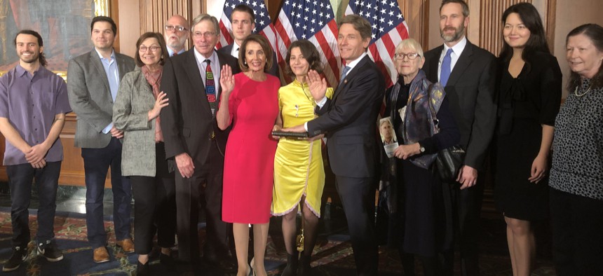 Rep. Tom Malinowski, D-N.J., and family members at a ceremonial swearing-in with House Speaker Nancy Pelosi.