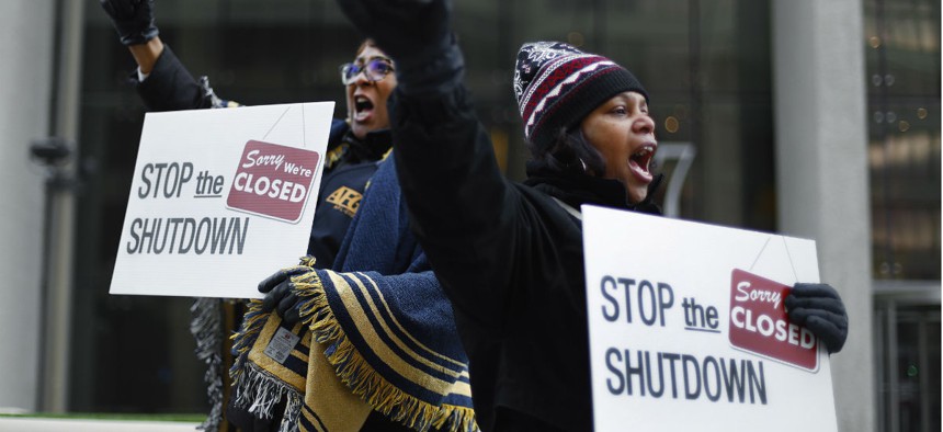 Federal employees rally in Detroit for an end to the shutdown. 
