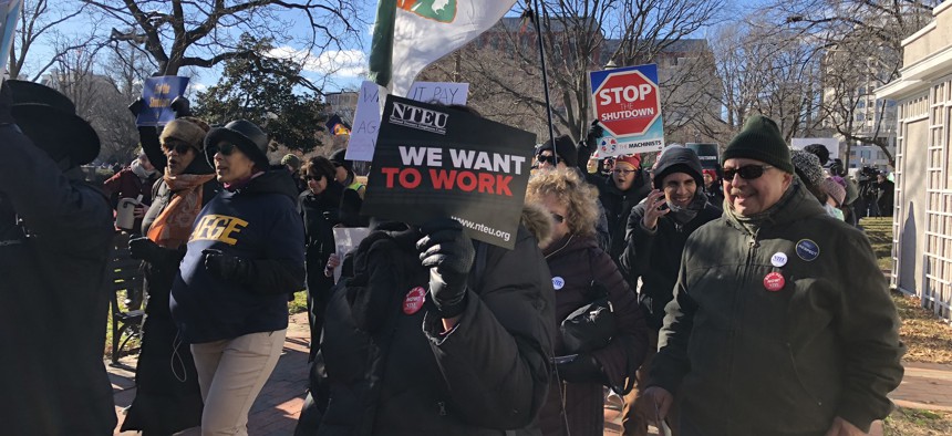 Feds rally outside the White House Thursday to stop the shutdown.
