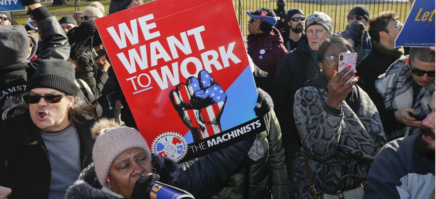 Union members and other federal employees rally outside the White House last week to end the partial shutdown. 
