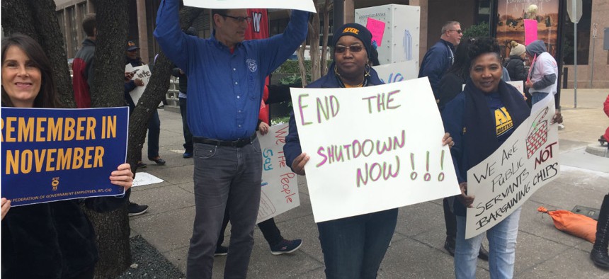 Union members rally in Dallas earlier this month to end the shutdown. 
