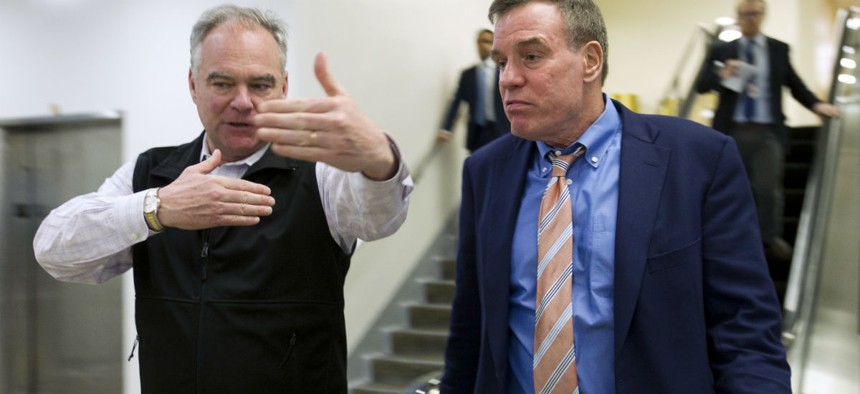 Virginia Democratic Sens. Tim Kaine (left) and Mark Warner are urging the OPM director to protect dental and vision benefits during the shutdown. 