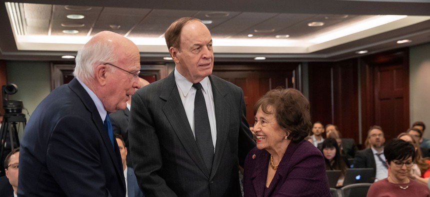 Senator Patrick Leahy, Senator Richard Shelby, and Representative Nita Lowey greet one another at Wednesday’s conference-committee meeting at the Capitol.