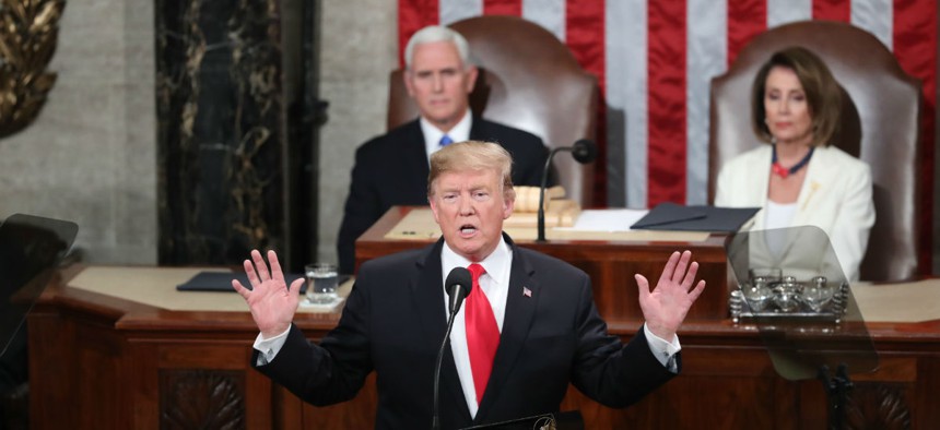 President Donald Trump delivers his State of the Union address to a joint session of Congress on Capitol Hill in Washington, as Vice President Mike Pence and Speaker of the House Nancy Pelosi look on.