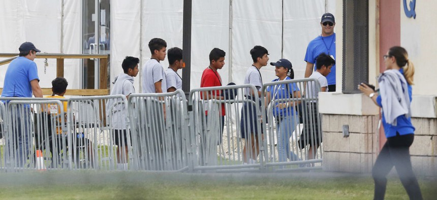 Immigrant children line up in June outside the Homestead Temporary Shelter for Unaccompanied Children. 